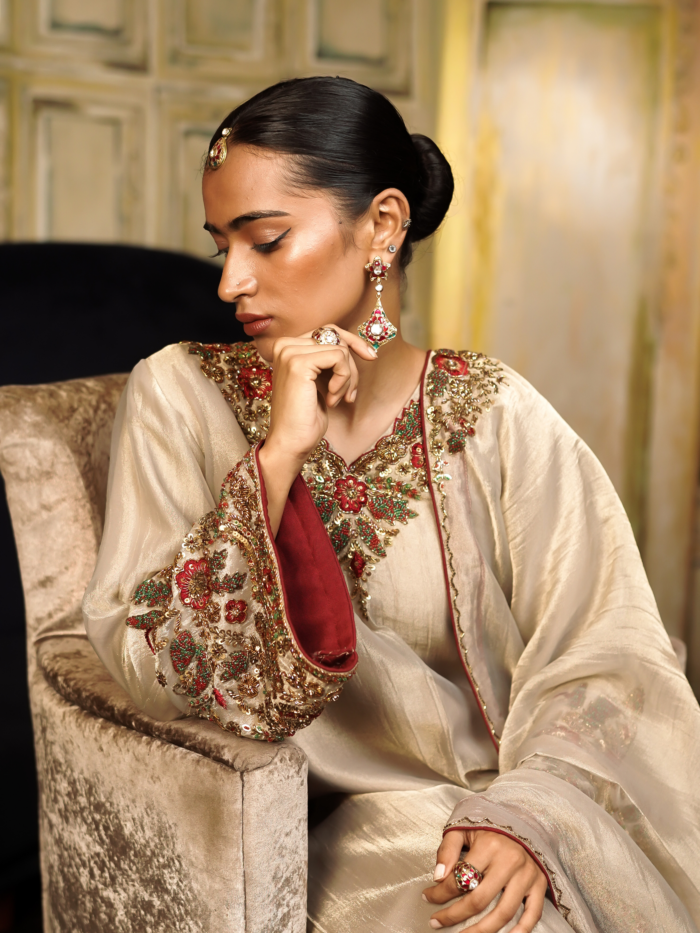 Luxury champagne gold festive tissue kurta palazzo set with hand-crafted embroidery and maroon border dupatta for wedding receptions.